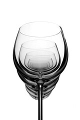 Wine glasses standing in row, empty glasswares isolated on white background, selective focus 