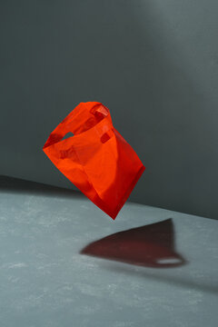 plastic bag on gray wall, gravity