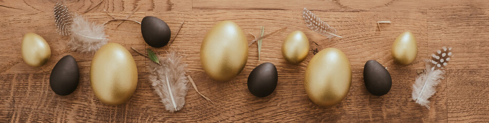 black and gold Easter egg border against a rustic wood background