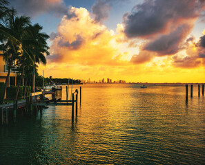 Fototapeta na wymiar sunset over the sea beautiful summer miami Florida ocean palms tropical coat boat pier 