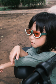 portrait of cute little girl with fashion sunglass