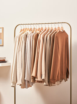 Stylish apparels on metal rack