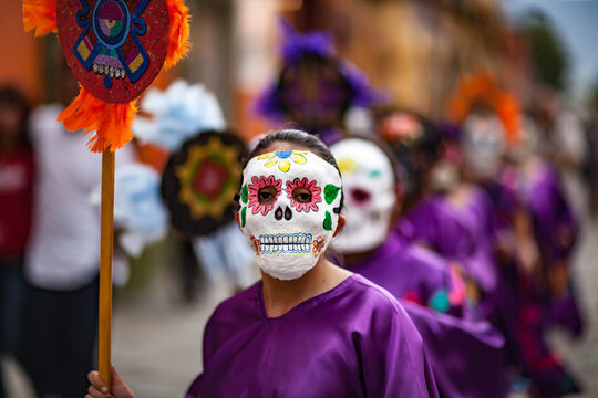 A Masked Woman in a Traditional Parade
