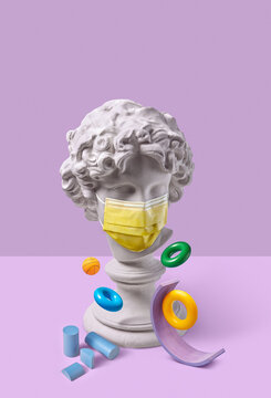 Cupid statue in face mask and balancing srtructure.