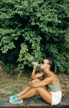 young woman drinking mineral water