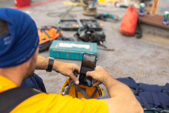 Working at elevations. Rope access, high-altitude outdoor work.