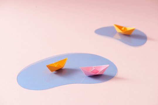 Folder paper ship boat origami on sea water,
