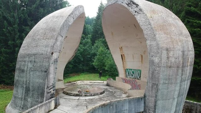 Bojiste, Bosnia and Herzegovina - July 15, 2019 Concrete monument Spomenik na Korcanici in Grmec mountain - move forward through the concrete monument