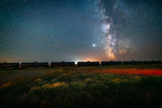 summer milky way over railway station