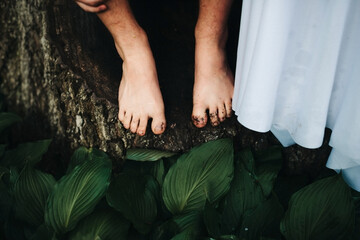 boy standing next to bride with dirty feet