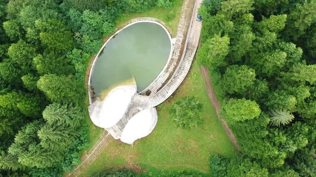 Bojiste, Bosnia and Herzegovina - July 15, 2019 Concrete monument Spomenik na Korcanici in Grmec mountain - straight view under drone