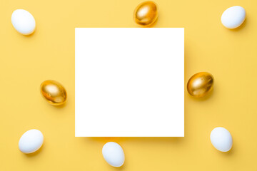 Easter set. Golden, white colour egg on pastel yellow background in Happy Easter decoration. Traditional design with copy space.