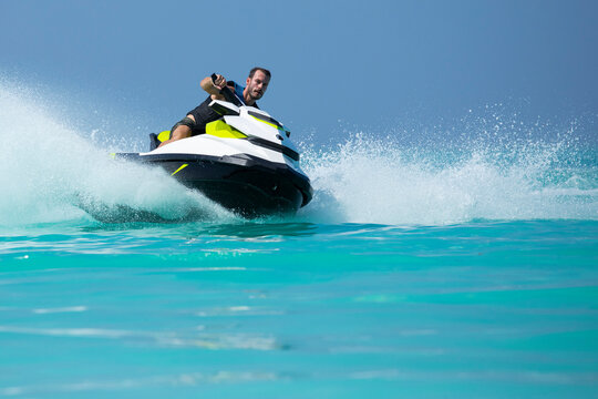 A man on a jetski in the Maldives