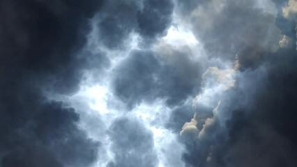 a thunderstorm in a dark cumulonimbus cloud with a flash of lightning, point of view