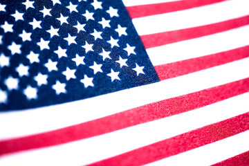 Fototapeta premium Macro Shot Of Handheld American Flag On Coarse Fabric