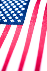 Fototapeta premium Macro Shot Of Handheld American Flag On Coarse Fabric