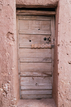 Old Rustic Door With A Clay Walls