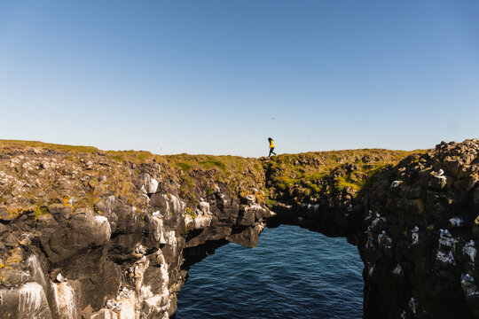 Girl standing on a cliff
