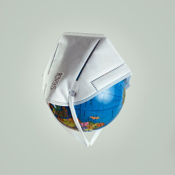 face mask on a world globe