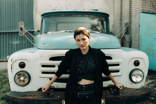 woman with black casual wear sitting on the old van