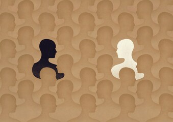 silhouettes of two people in a crowd