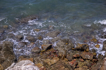 The beach with many rocks.