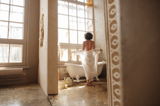 Unrecognizable woman ready to take bath