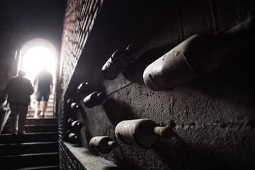 Anonymous people leaving dark cellar