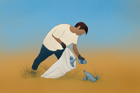 Teenage environmentalist cleaning a sand dune