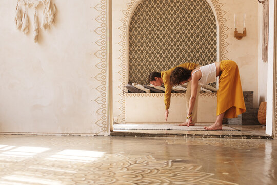 Couple standing in Halfway Lift pose