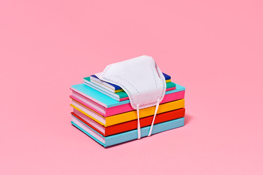 Books, notebooks and face mask