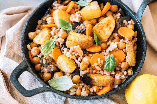 Spelt salad with roasted potatoes, chickpeas, carrots, aubergine
