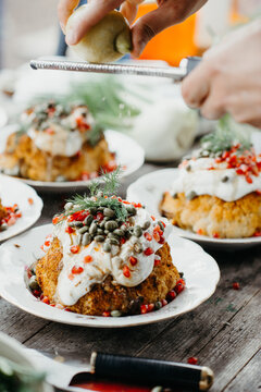 Baked cauliflower topped with cream, nuts and herbs. Topping of with citron zest