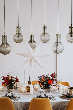 Festive Christmas table decorated for dinner with friends of family indoors