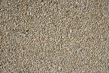 A wall of granite stones as a background.