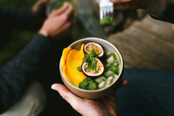 Fruit bowl with passion fruit, kiwi and mango