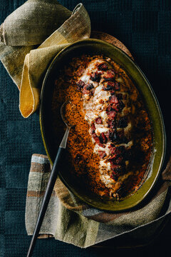 Meat stuffed with bacon and cheese from the oven with tomato sauce