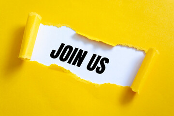 Join us - message appearing behind torn yellow paper. Hiring and new job concept