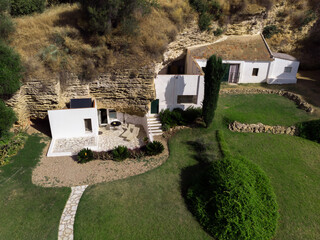 Exterior of residential house built into rock