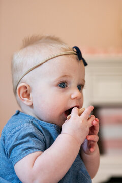 Baby Teething On Building Block
