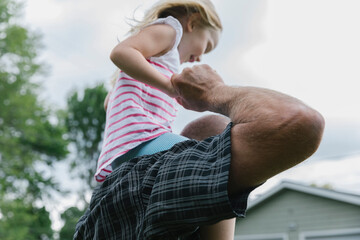 Daughter Riding on Father Shoulders