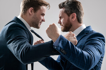 fist punching selective focus. aggressive negotiations. businessmen having conflict.