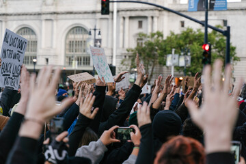 A crowd with their hands in the air