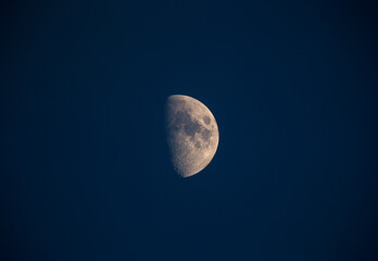A half moon in the sky.
