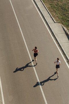 Women running on street