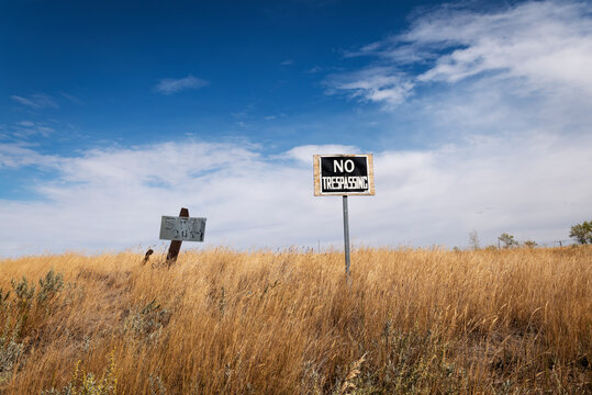 A no trespassing sign on the prairies.