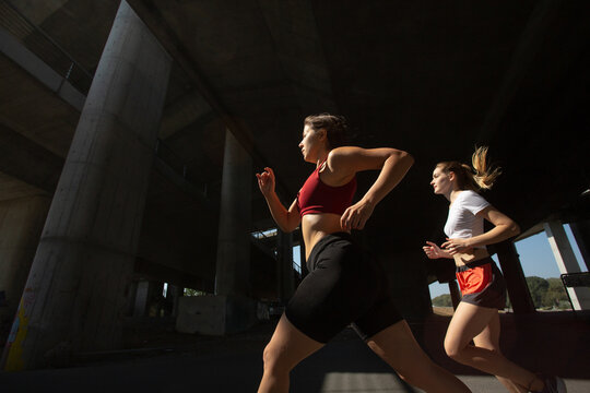 Beautiful women running in urban area