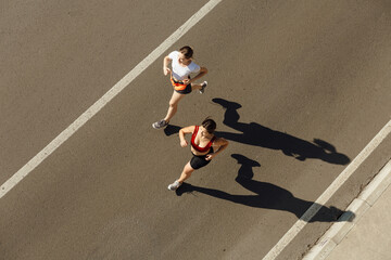 Women running on street