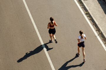 Women running on street