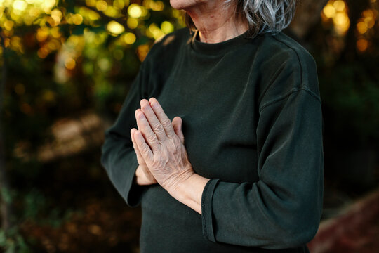 Senior Hands in namaste